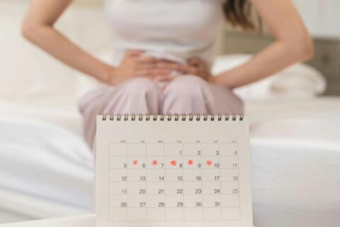woman experiencing menstrual cramps